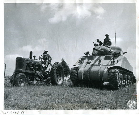 a farmer and tank chat during WWII training is southern, middle Tennessee